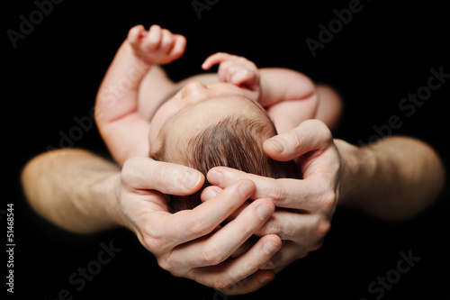 Photo: Male hands with baby Male hands with baby