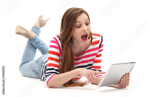 Photo: Amazed woman with digital tablet Amazed woman with digital tablet