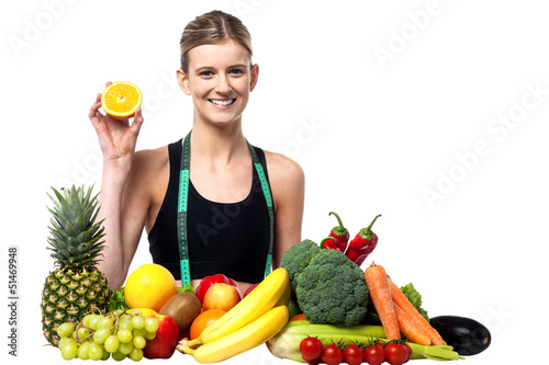 Photo: The beautiful girl with fruits and vegetables The beautiful girl with fruits and vegetables