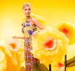 Beautiful young blond woman in colourful dress 
