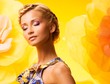 Beautiful young blond woman in colourful dress 