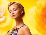 Beautiful young blond woman in colourful dress 