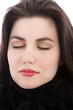 Relaxed brunette woman with eyes closed, close up
