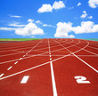 Running track with lanes over sky and clouds