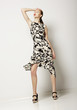 Fashion Woman in Light Spotty Dress. Contemporary Apparel
