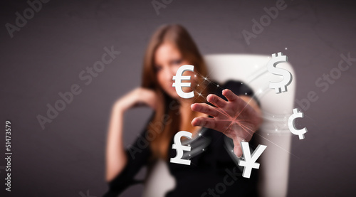 Photo: Young lady throwing currency icons Young lady throwing currency icons