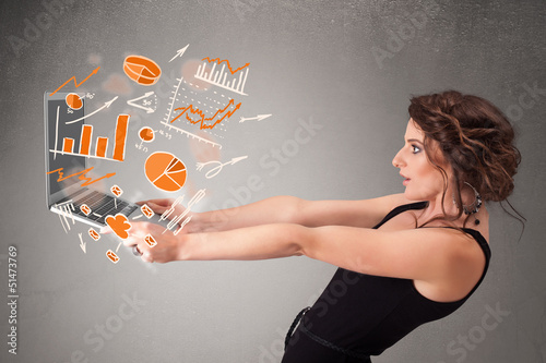 Photo: Beautiful lady holding notebook with graphs and statistics Beautiful lady holding notebook with graphs and statistics