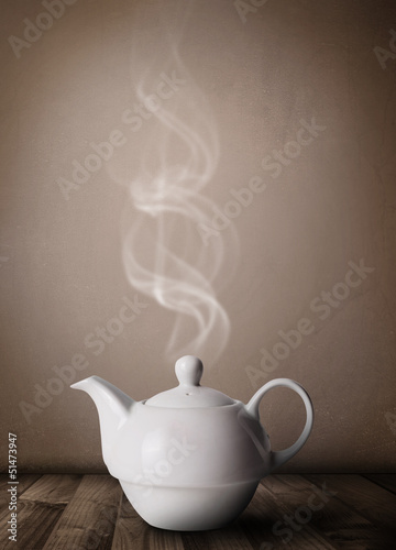 Photo: Tea pot with abstract white steam Tea pot with abstract white steam