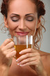 Beautiful woman in towel with herbal tea