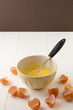 Broken eggshells around mixing bowl