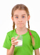 Girl tasting a glass of milk