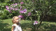 Child Sneezing after Smelling Spring Flowers in Park, Children