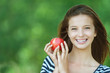 Photo: portrait of attractive girl eating apple portrait of attractive girl eating apple