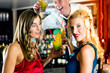 Photo: Young women with cocktails in club or Bar Young women with cocktails in club or Bar