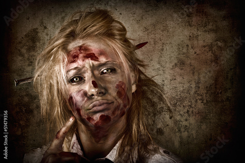 Photo: Evil grunge zombie business woman thinking idea Evil grunge zombie business woman thinking idea