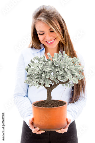 Photo: Business woman with a money tree Business woman with a money tree
