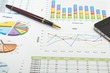 Financial paper charts and graphs with iphone and calculator