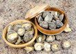 Two turned bowls with dry mushrooms