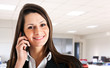 Smiling businesswoman talking at the phone