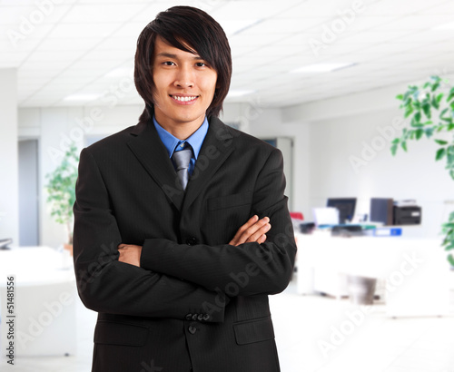 Photo: Asian businessman in his office Asian businessman in his office