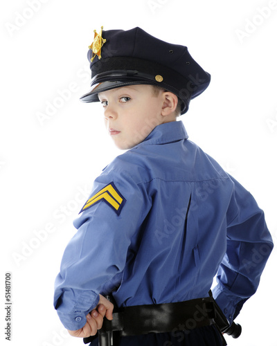 Photo: Little Cop Looking Over Shoulder Little Cop Looking Over Shoulder