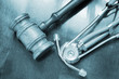 Gavel and stethoscope on wooden background
