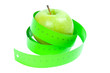 Dieting concept. Green apple and tape measurement