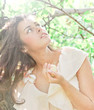 Photo: morning purity of gorgeous woman over apple tree with fruit in a morning purity of gorgeous woman over apple tree with fruit in a