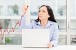 Woman drawing positive business growth