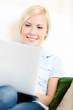 Close up of woman sitting with silver computer