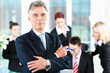 Business Team with leader in office