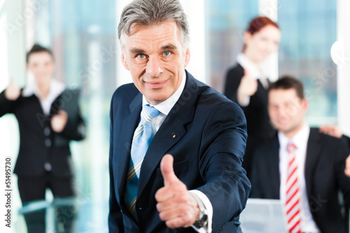 Photo: Business - team in an office Business - team in an office