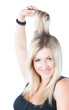 portrait of beautiful  woman combing her blondy hair