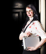 Dead female zombie worker holding briefcase
