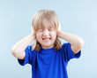 boy covering his ears