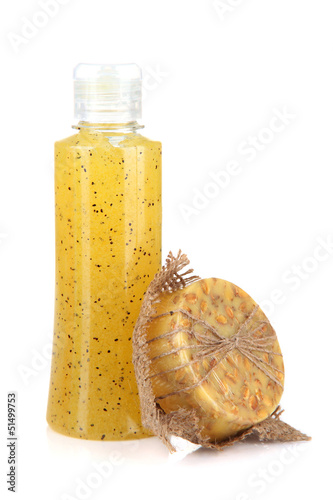Photo: Bottle with scrub and hand-made soap, isolated on white Bottle with scrub and hand-made soap, isolated on white