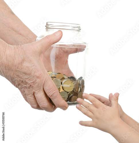 Photo: elderly person transfers to bank to hands of the child elderly person transfers to bank to hands of the child