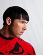 The dark-haired man on a white background