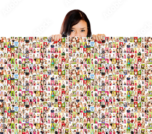 Photo: smiling woman is holding a lot of people portraits smiling woman is holding a lot of people portraits