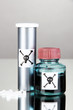 Deadly poison in bottles on grey background