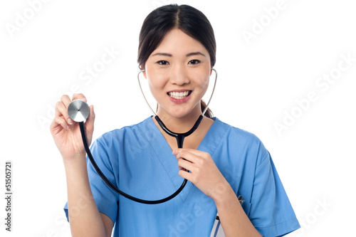 Photo: Female physician posing with stethoscope Female physician posing with stethoscope