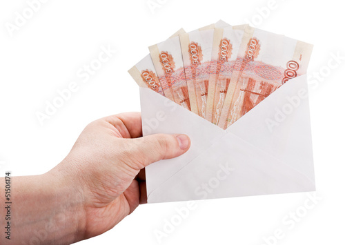 Photo: hand holding an envelope with rubles hand holding an envelope with rubles