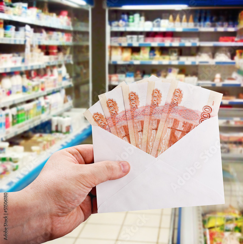 Photo: hand with rubles in the envelope hand with rubles in the envelope