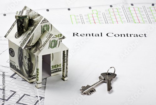Photo: house made of money and the keys to a new home house made of money and the keys to a new home