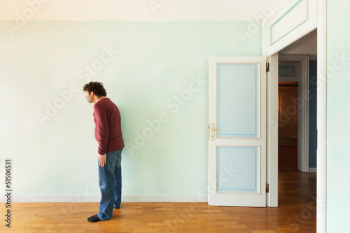 Photo: portrait of a weird guy in the room with the door open portrait of a weird guy in the room with the door open