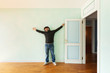 portrait of a weird guy in the room with the door open