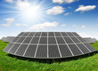 Solar energy panels against blue sky with clouds