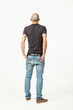 Photo: portrait of young man in studio, back view portrait of young man in studio, back view