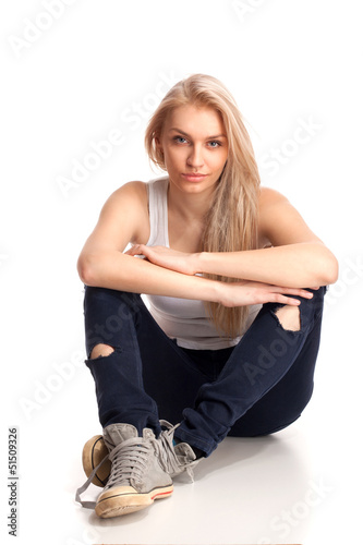 Photo: Blond teenage girl sitting Blond teenage girl sitting