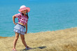 girl in a hat and skirt